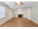 Bright living room with hardwood floors, fireplace, and ample natural light at 16 S Church, Coats, NC 27521