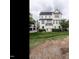 Townhouse with manicured lawn, bushes and small trees at 1610 Draper View Loop # 101, Raleigh, NC 27608