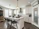 Modern kitchen with white cabinetry, stainless steel range hood, ample counter space and eat in seating at 1610 Draper View Loop # 101, Raleigh, NC 27608