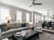 Spacious living room with modern furnishings, natural light, and seamless flow into the dining and kitchen areas at 1610 Draper View Loop # 101, Raleigh, NC 27608