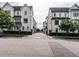 Street view of townhomes with manicured lawns at 1610 Draper View Loop # 101, Raleigh, NC 27608