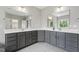 Modern bathroom featuring double vanities and large mirrors at 1625 Banks View Dr, Raleigh, NC 27603