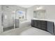 Elegant bathroom featuring a glass-enclosed shower and a soaking tub at 1625 Banks View Dr, Raleigh, NC 27603