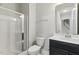 Bathroom featuring a walk-in shower, toilet, and vanity with a dark cabinet at 1625 Banks View Dr, Raleigh, NC 27603