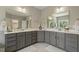Spacious bathroom featuring double vanities, large mirrors, and ample counter space at 1625 Banks View Dr, Raleigh, NC 27603