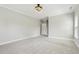 A spacious bedroom with neutral colors, large window and carpet at 1625 Banks View Dr, Raleigh, NC 27603
