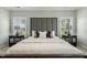 Stylishly decorated bedroom with a large, padded headboard and neutral color palette at 1625 Banks View Dr, Raleigh, NC 27603