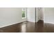 Empty bedroom with hardwood floors, a window, and natural light at 1625 Banks View Dr, Raleigh, NC 27603