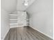 Bonus room with wood floors, a ceiling fan, and small storage shelves at 1625 Banks View Dr, Raleigh, NC 27603