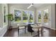 Bright breakfast nook with lots of light from the large picture windows and door to the patio at 1625 Banks View Dr, Raleigh, NC 27603