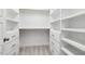 Walk-in closet featuring ample shelving and storage drawers at 1625 Banks View Dr, Raleigh, NC 27603