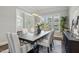This dining room features bright natural light, modern decor, and seating for six at 1625 Banks View Dr, Raleigh, NC 27603