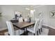 This dining room features a modern light fixture, art, and seating for six at 1625 Banks View Dr, Raleigh, NC 27603