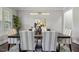 Dining room features a modern light fixture, six chairs, and hardwood floors at 1625 Banks View Dr, Raleigh, NC 27603