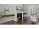 The fireplace features a mounted TV, floating shelves, and modern decor at 1625 Banks View Dr, Raleigh, NC 27603