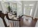 Inviting foyer features a hardwood floor, decorative rug, and a view into the adjacent sitting area at 1625 Banks View Dr, Raleigh, NC 27603