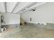 Attached garage with concrete floors, a staircase, and block foundation at 1625 Banks View Dr, Raleigh, NC 27603