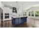 Well-lit kitchen with a large island, stainless steel appliances, and hardwood floors at 1625 Banks View Dr, Raleigh, NC 27603