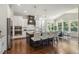 Modern kitchen with a navy blue island, seating for four, stainless steel appliances, and hardwood floors at 1625 Banks View Dr, Raleigh, NC 27603