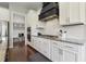 Bright kitchen with white cabinets, granite countertops, and stainless steel appliances at 1625 Banks View Dr, Raleigh, NC 27603