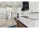 Modern kitchen with stainless steel appliances, white cabinetry, and granite countertops at 1625 Banks View Dr, Raleigh, NC 27603