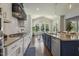Gourmet kitchen features granite countertops, stainless appliances, and an island with bar seating at 1625 Banks View Dr, Raleigh, NC 27603