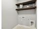Convenient laundry room with shelving and necessary hookups at 1625 Banks View Dr, Raleigh, NC 27603