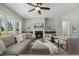 The inviting living room offers a fireplace, natural light, and comfortable seating at 1625 Banks View Dr, Raleigh, NC 27603