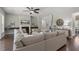 A well-appointed living room offers a fireplace, neutral tones, hardwood floors, and comfortable seating at 1625 Banks View Dr, Raleigh, NC 27603
