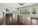 Bright and airy living space showcasing hardwood floors, abundant natural light, and kitchen access at 1625 Banks View Dr, Raleigh, NC 27603