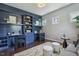 Stylish office features built-in bookshelves, work space, and a comfortable sofa at 1625 Banks View Dr, Raleigh, NC 27603