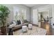 Comfortable sitting room with hardwood floors and view of the adjacent dining room at 1625 Banks View Dr, Raleigh, NC 27603