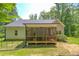 Spacious backyard featuring a screened porch and a well-maintained lawn at 167 Sequoia Dr, Timberlake, NC 27583