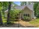 Private backyard featuring a screened-in porch and lush greenery, creating a peaceful outdoor space at 167 Sequoia Dr, Timberlake, NC 27583