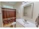 Well-lit bathroom with a marble countertop, modern sink, and a decorative shower curtain at 167 Sequoia Dr, Timberlake, NC 27583