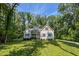 Attractive home with a beautiful lawn, mature trees, and a welcoming front entrance at 167 Sequoia Dr, Timberlake, NC 27583