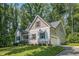Charming two-story home with a well-manicured lawn, landscaped garden, and attached garage, showcasing curb appeal at 167 Sequoia Dr, Timberlake, NC 27583