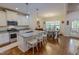 Bright kitchen with a large island, granite countertops, and a dining area with natural light at 167 Sequoia Dr, Timberlake, NC 27583