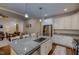 Gourmet kitchen with granite island, stainless steel appliances, and ample cabinet space, perfect for entertaining at 167 Sequoia Dr, Timberlake, NC 27583