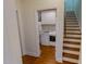 A laundry room featuring a modern washer and dryer next to the stairs at 167 Sequoia Dr, Timberlake, NC 27583