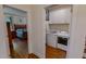 Convenient laundry area featuring modern appliances, white cabinetry, and easy access to the bedroom at 167 Sequoia Dr, Timberlake, NC 27583
