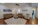 Cozy living room with comfortable seating, a plush rug, and hardwood floors at 167 Sequoia Dr, Timberlake, NC 27583