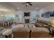 Open floor plan with a living room featuring a cozy fireplace and hardwood floors at 167 Sequoia Dr, Timberlake, NC 27583