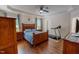Spacious main bedroom with tray ceiling, wood floors, and ample natural light at 167 Sequoia Dr, Timberlake, NC 27583
