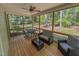 Relaxing screened porch with comfortable seating, perfect for enjoying the outdoors at 167 Sequoia Dr, Timberlake, NC 27583