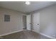 Neutral bedroom with a carpeted floor, and featuring a closet and an entry door at 1708 Forest Rd, Durham, NC 27705
