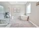 Modern bathroom with a freestanding tub, glass-enclosed shower, and neutral finishes for a spa-like experience at 1824 Irish Blvd, Sanford, NC 27332