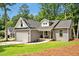 Charming single-Gathering home with attached two-car garage, manicured lawn, and inviting front porch at 1824 Irish Blvd, Sanford, NC 27332