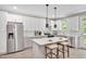 Modern kitchen with white cabinets, stainless steel appliances, and a spacious island at 1824 Irish Blvd, Sanford, NC 27332