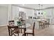 Stylish kitchen featuring white cabinetry, stainless appliances, and island with seating at 1824 Irish Blvd, Sanford, NC 27332
